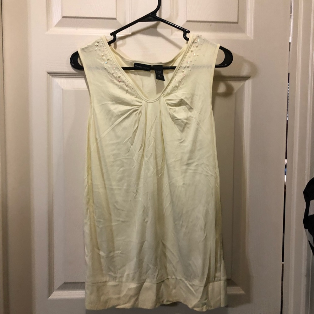 Sleeveless yellow top with beaded neck